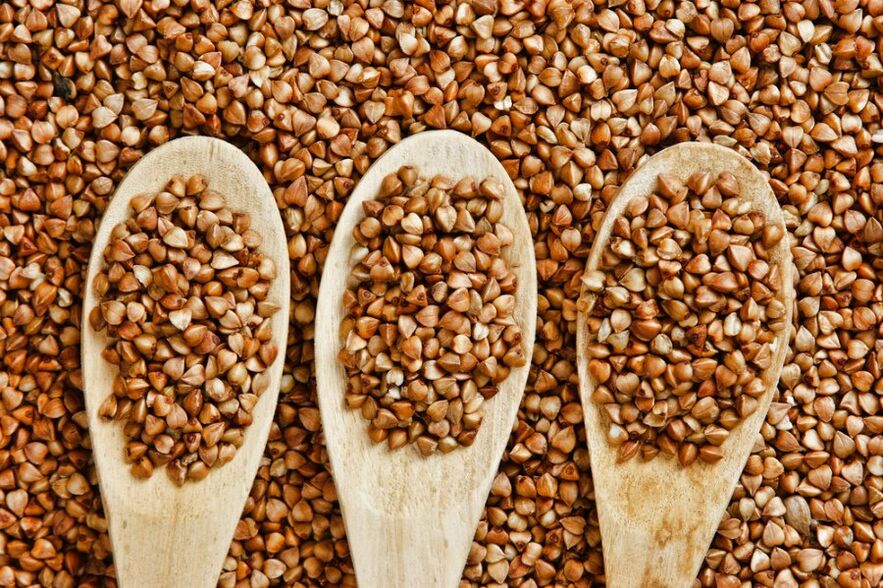 Buckwheat in a wooden spoon